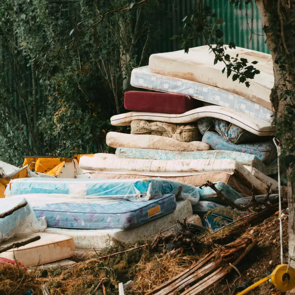 Team of Junk Champs Junk Removal efficiently removing an old mattress in Lancaster County